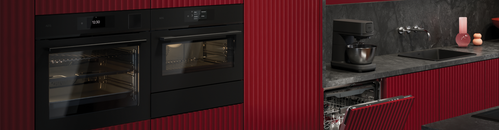 Red kitchen with matte black ovens